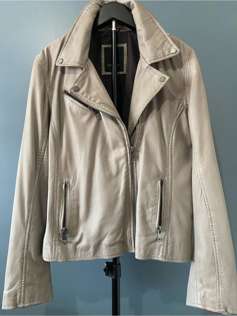 Women’s taupe leather jacket with detail